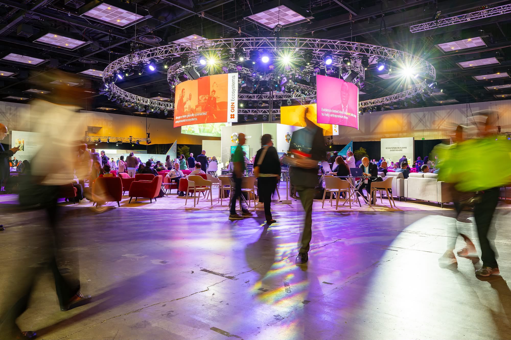 Delegates connecting in a busy exhibition and networking hall